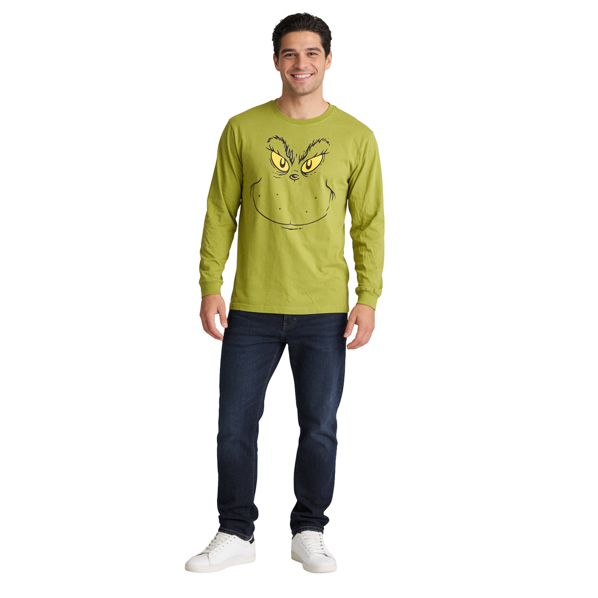 Smiling man wearing the Grinch Big Face long sleeve shirt with jeans, front view on white