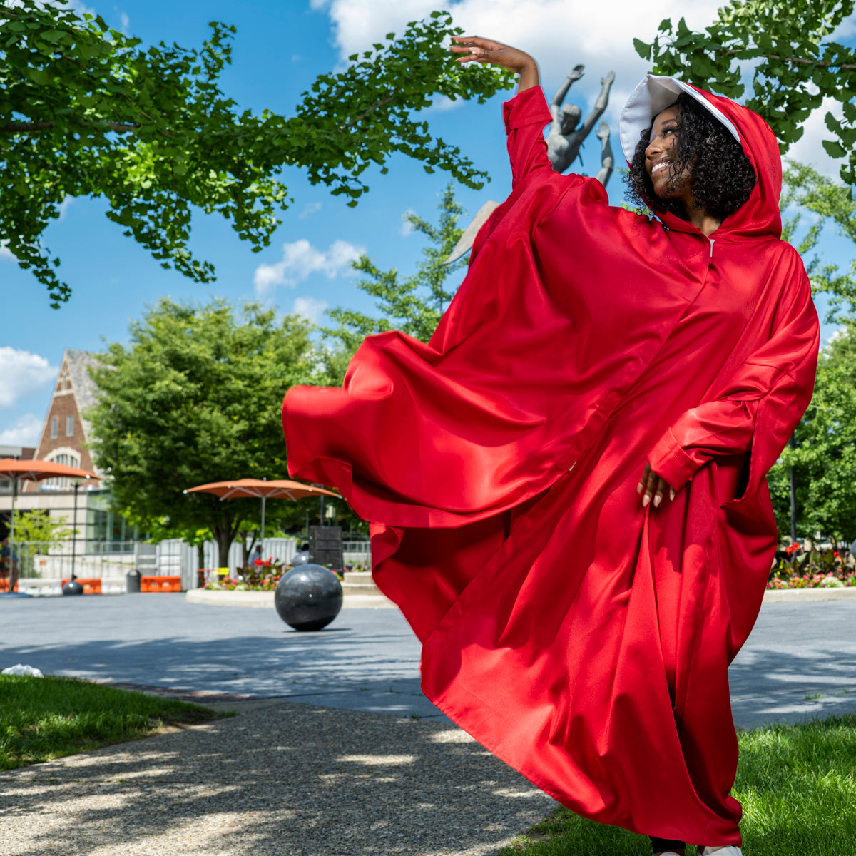 The Handmaid's Tale Red Cloak and White Hat Costume Dance pose