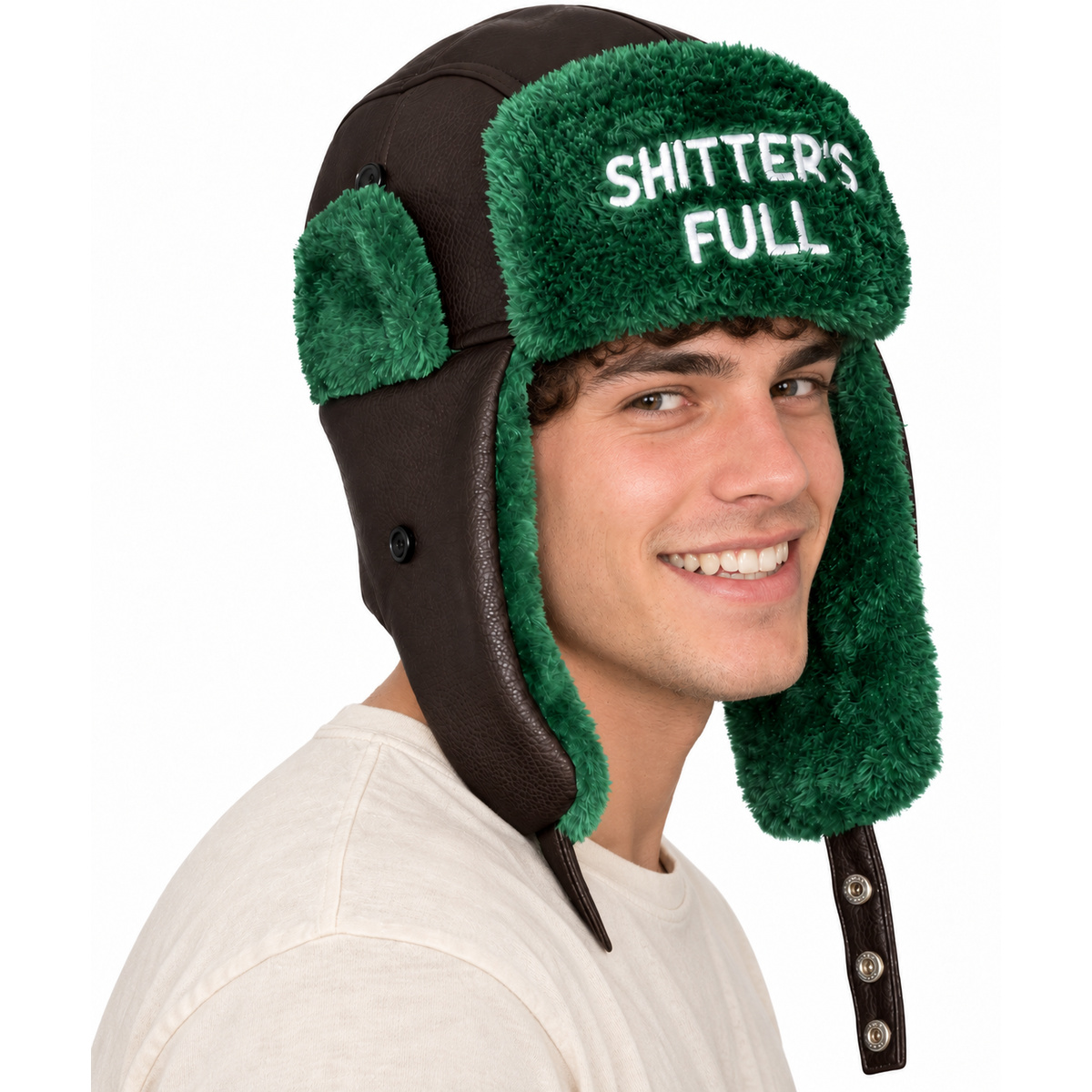 Man wearing Shitters Full embroidered trapper hat with green faux fur, three-quarter view on white