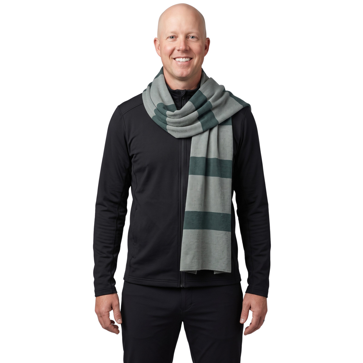 Smiling bald man in black wearing the grey striped Gru costume scarf
