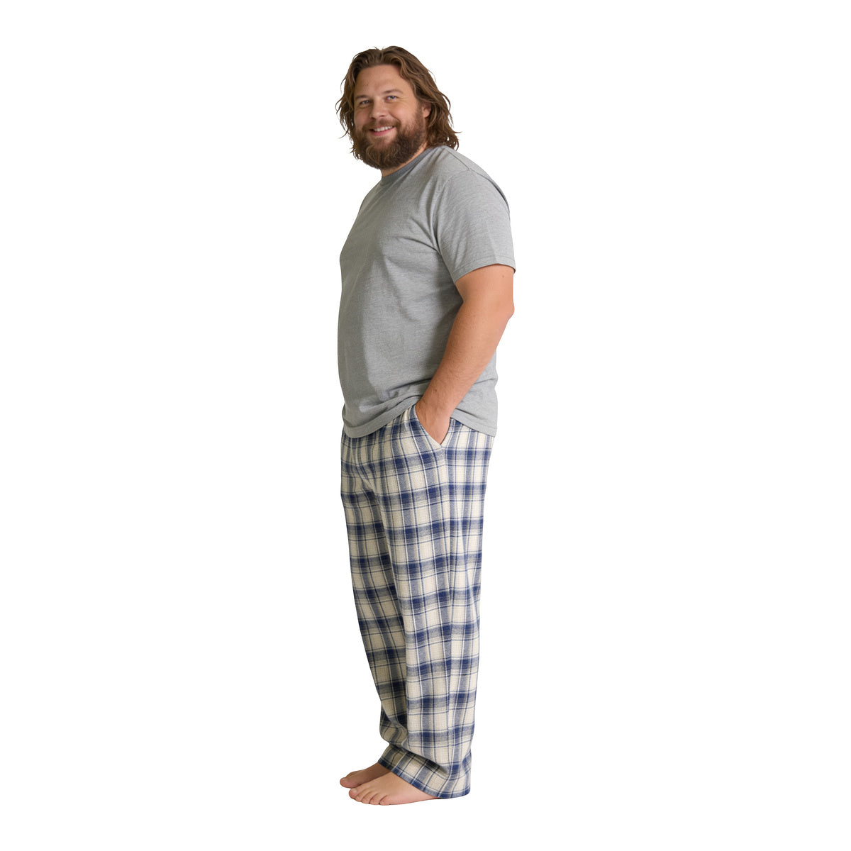 Man in the Thunder God plaid lounge pants, three-quarter view on white