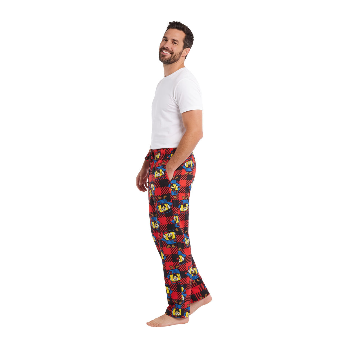 Man in the red SpongeBob Puffer and Snow sleep pants, side view on white