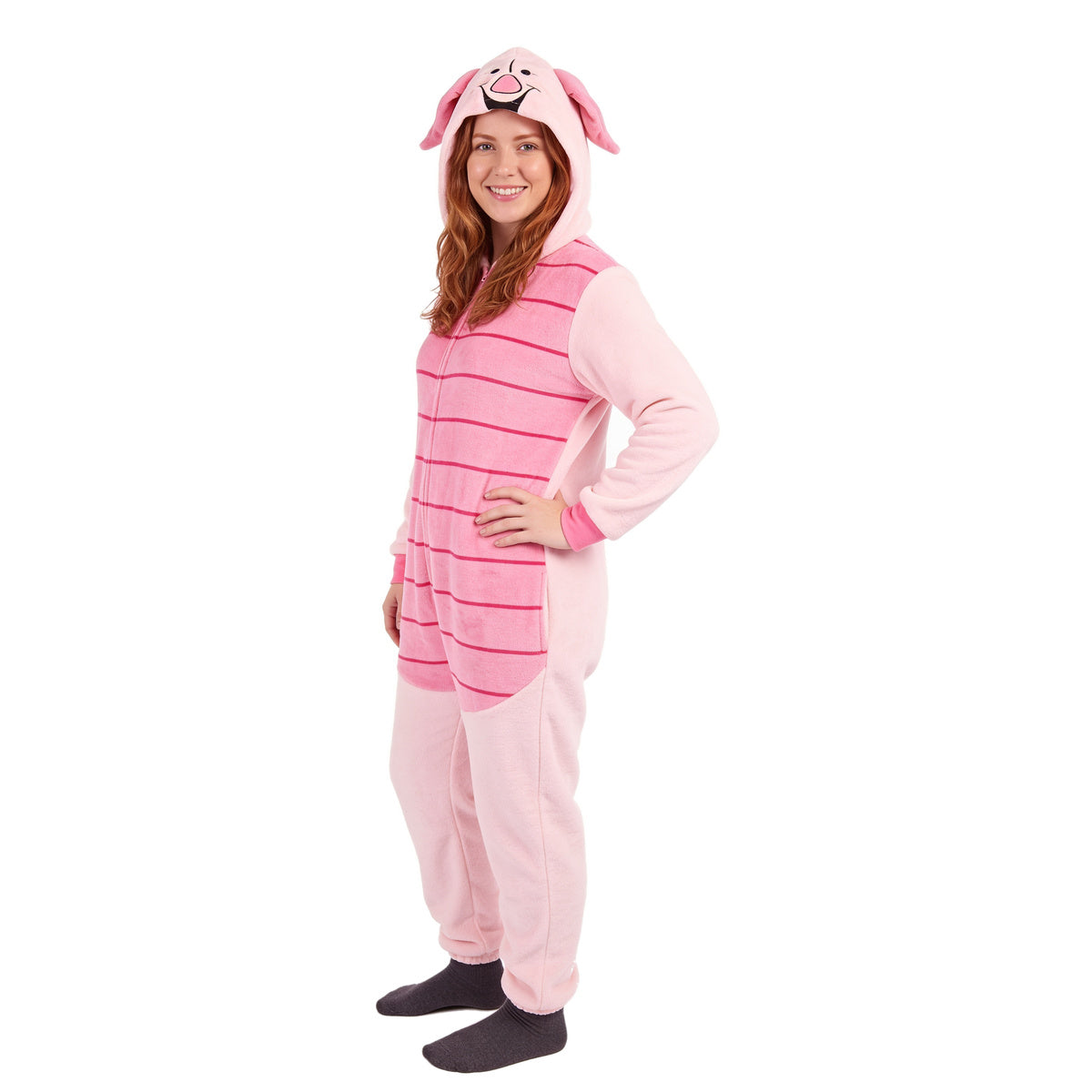 Woman with a hand on her hip in the Piglet unionsuit, three-quarter view