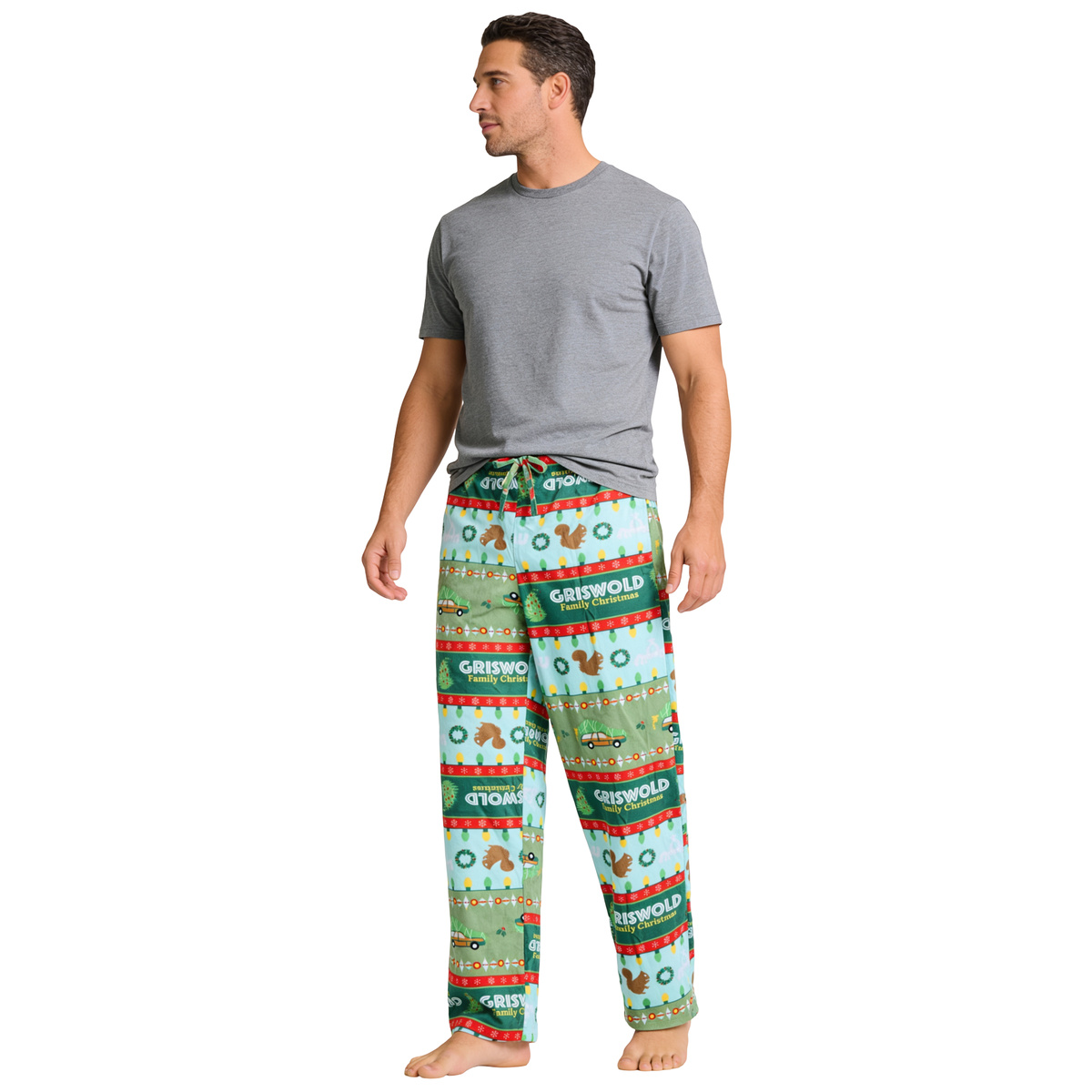 Man in a grey tee wearing the Griswold Fair Isle plush sleep pants, three-quarter view