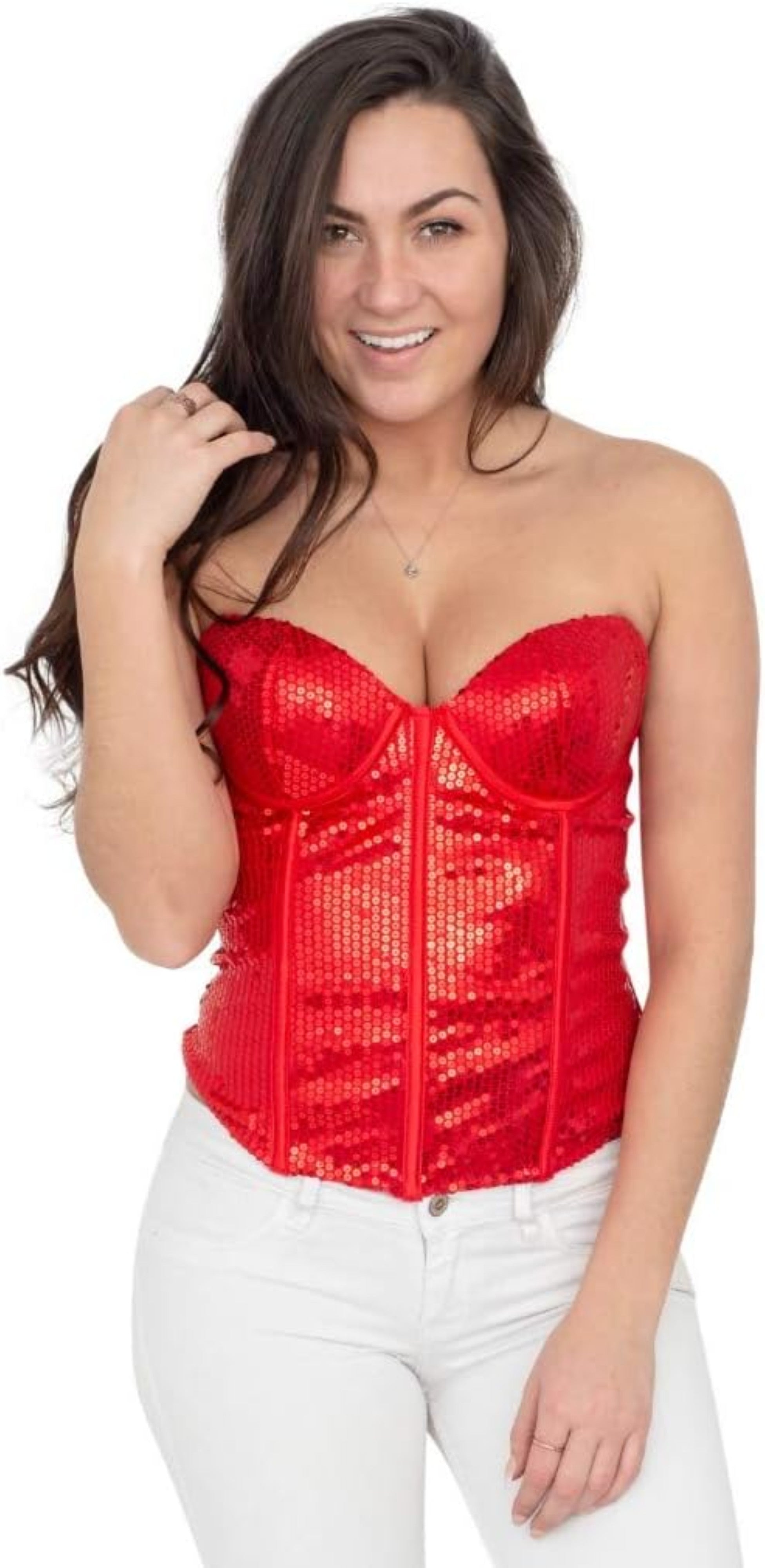 A woman modeling a bright red strapless sequin corset top paired with white pants, set against a plain white background.